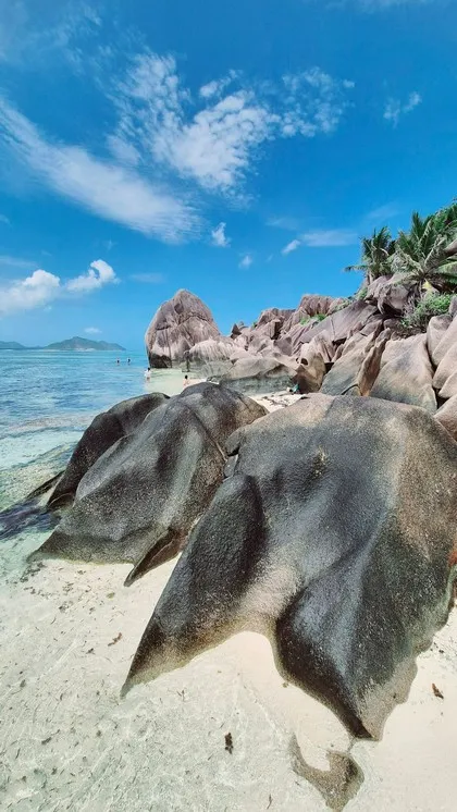 Granitfelsen und türkisfarbenes Wasser an der Anse Source d'Argent, La Digue
